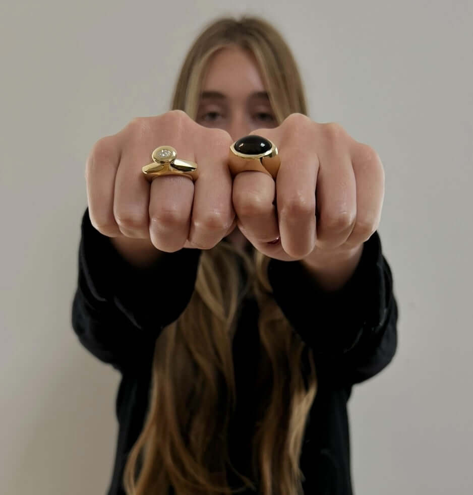 woman wearing gold rings