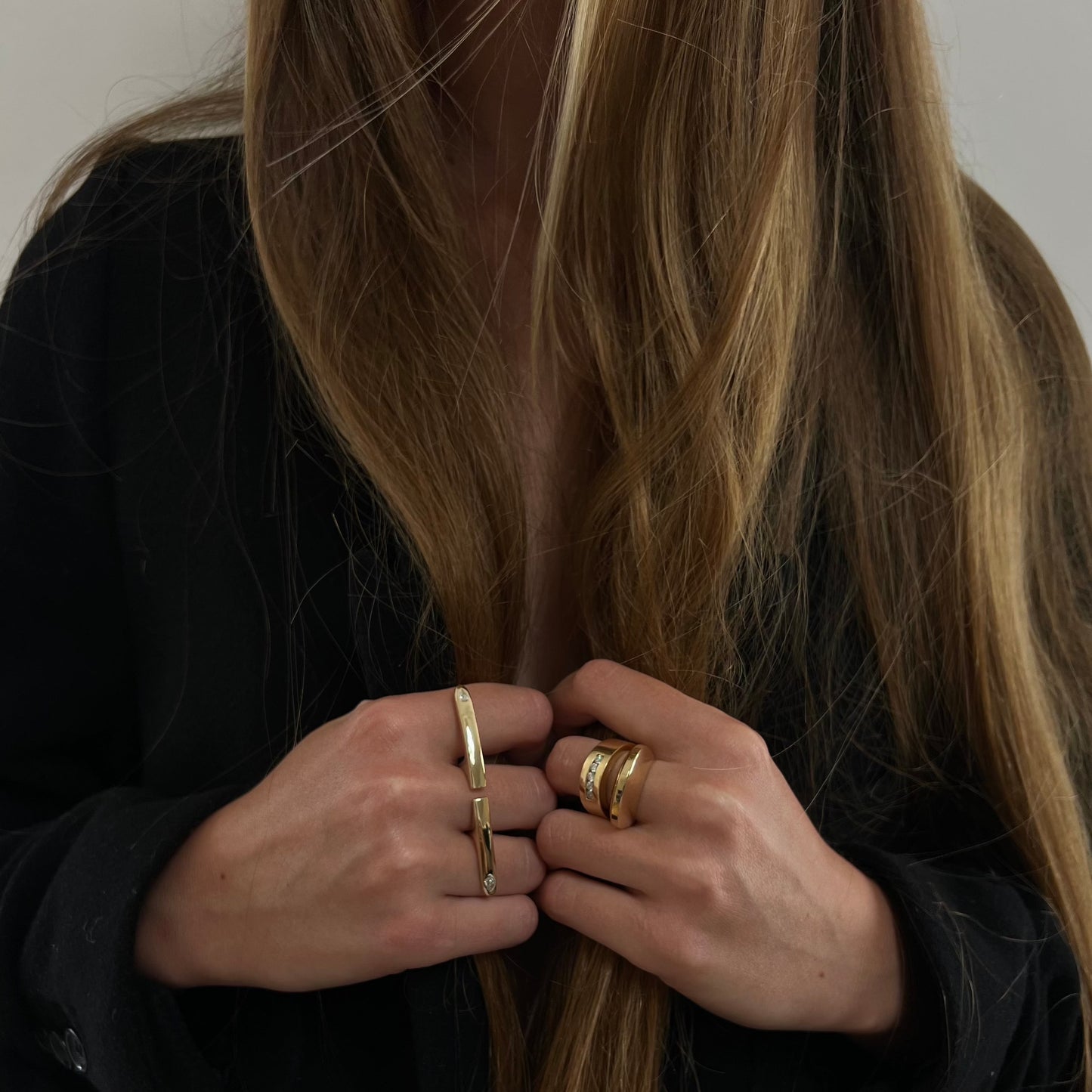 woman wearing gold rings