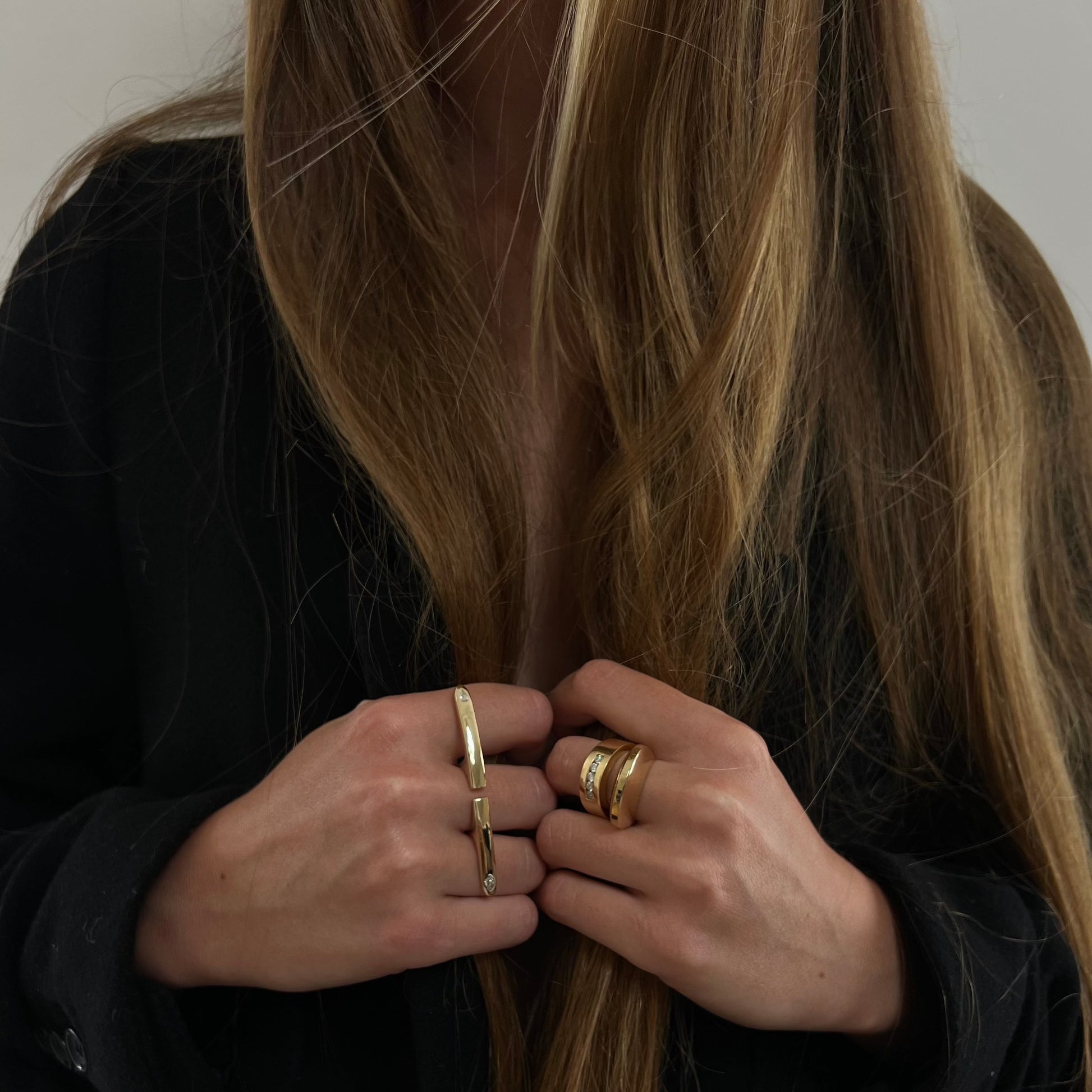 woman wearing gold rings