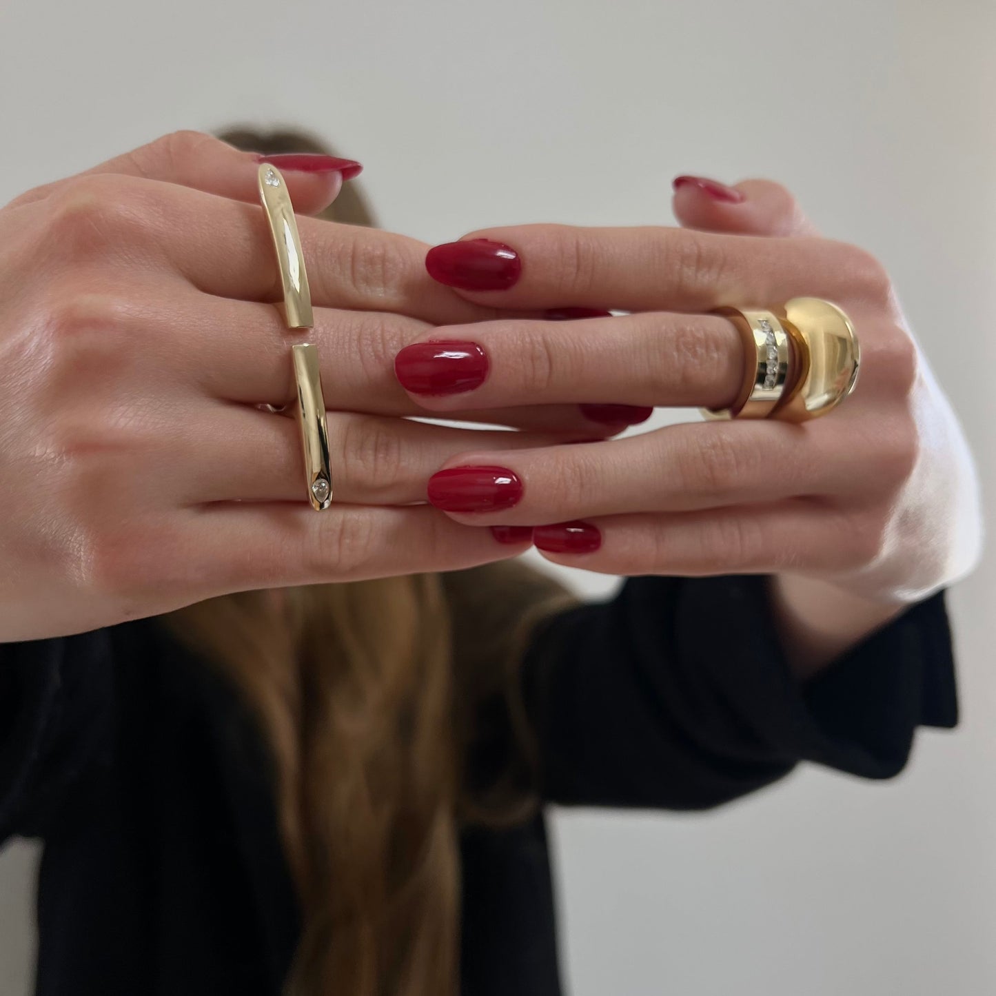 woman wearing gold rings